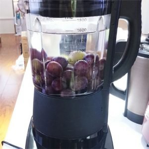 Place the grapes in a blender